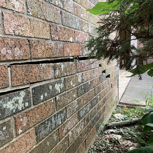 Home foundation showing settlement before polyurethane repair