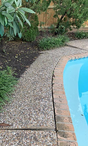 Pool deck with cracks and settlement before polyurethane lifting