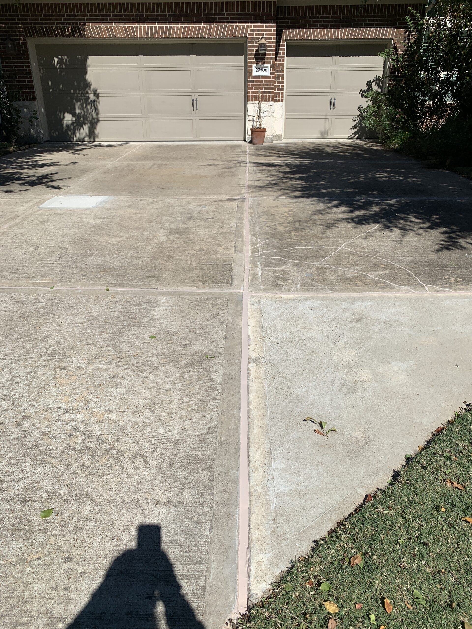 Repaired driveway after lifting in Katy TX