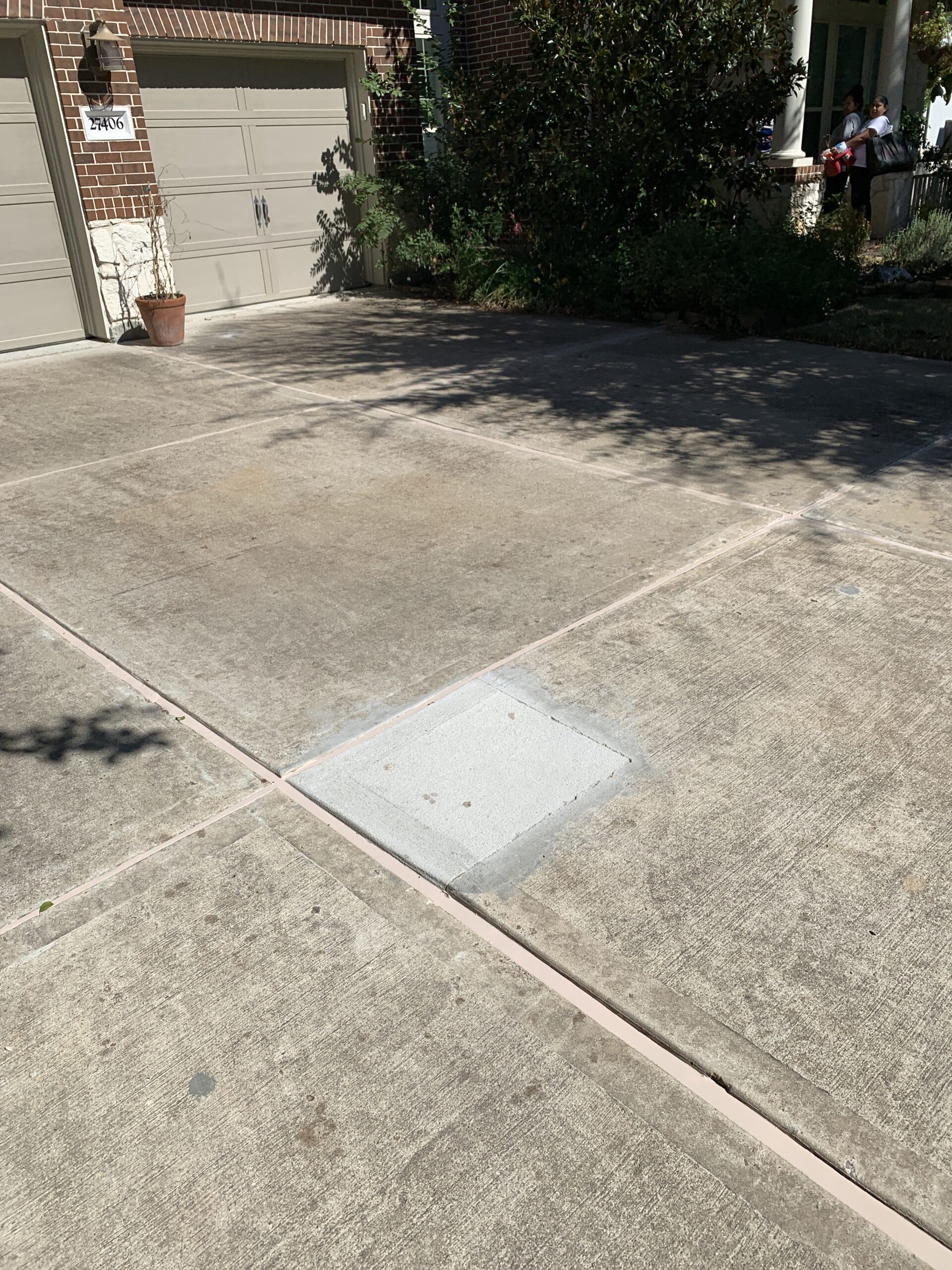 Sunken driveway before repair in Katy TX