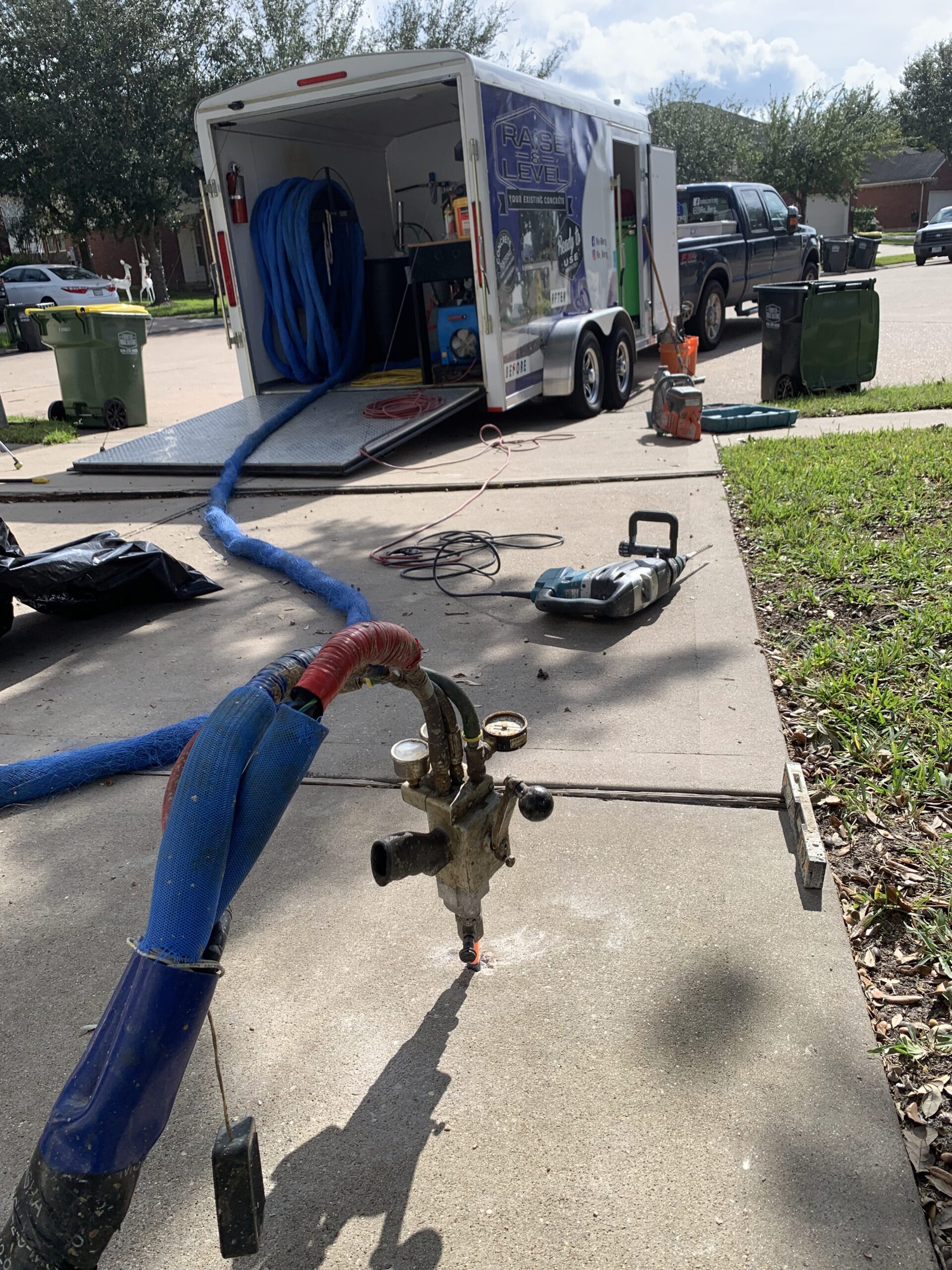 Driveway being lifted and leveled by Ro-Berg Concrete Repair Specialist